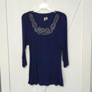 Women's navy blouse with detailed neck